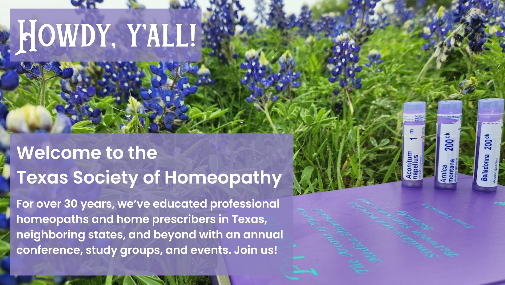 A homeopathic book and remedies in a field of bluebonnets.