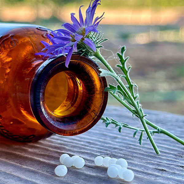 Homeopathy bottle and flower